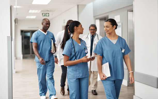 doctor nurse and walking hospital team after success surgery medicine meeting or clinic doctor nurse and walking hospital team after success surgery medicine meeting or clinic